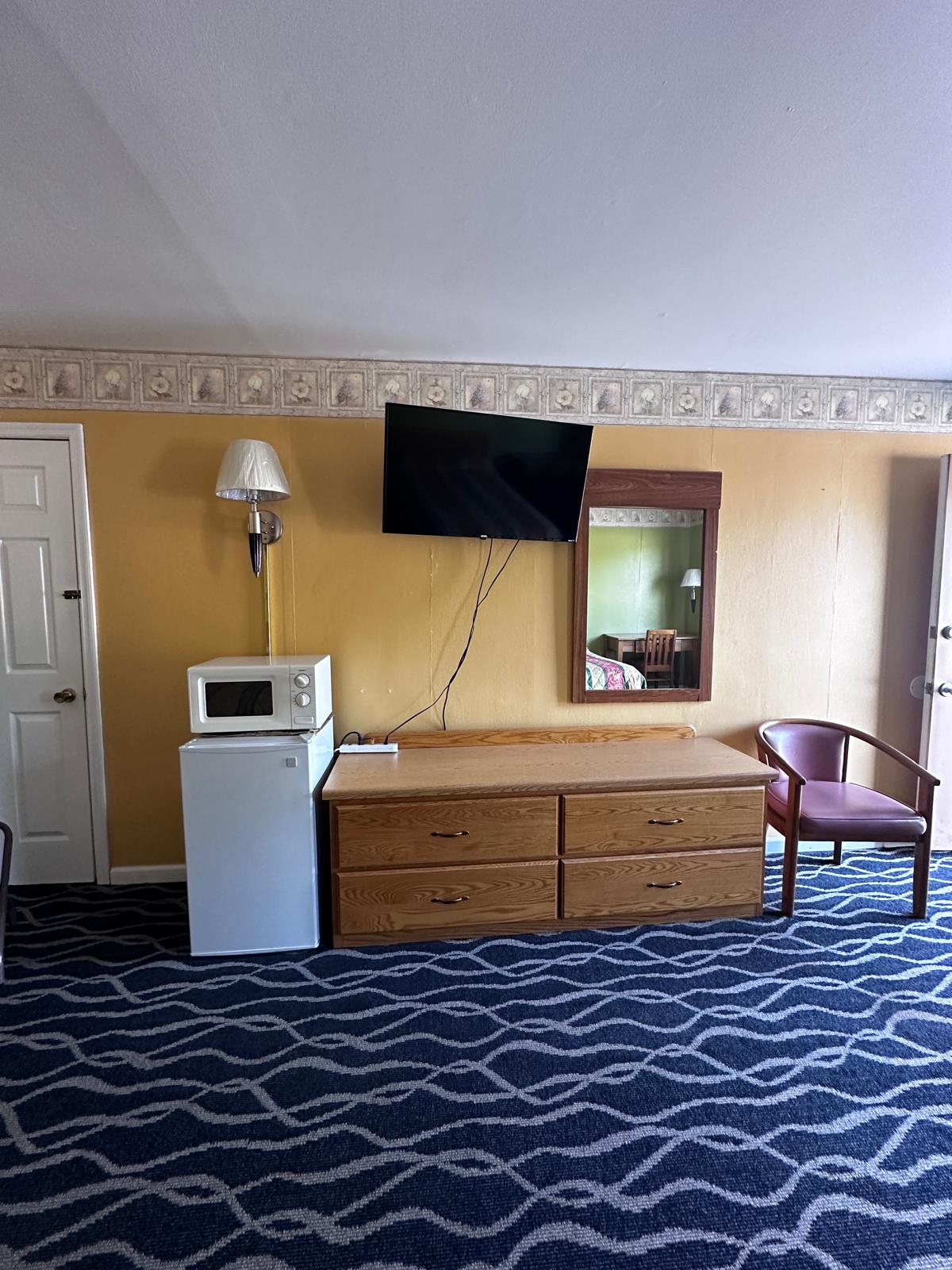 Guest room with queen beds and soft lighting